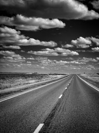 Road by land against sky