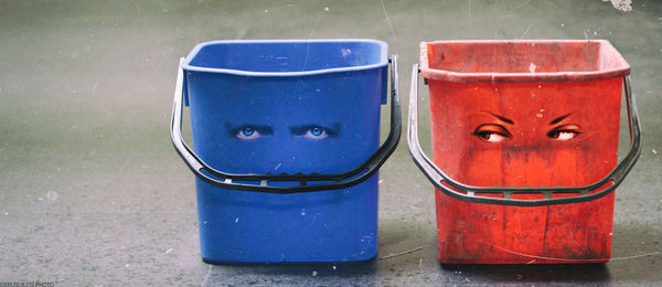 Close-up of eye painting on buckets