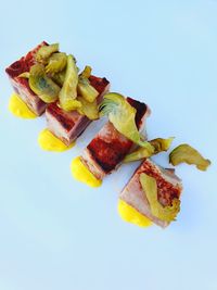 High angle view of breakfast on plate against white background