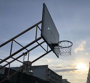 Low angle view of basketball hoop against sky