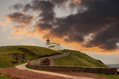 Lighthouse with dramatic sky.