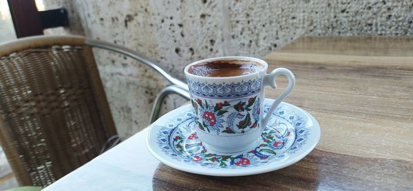 Close-up of coffee cup on table