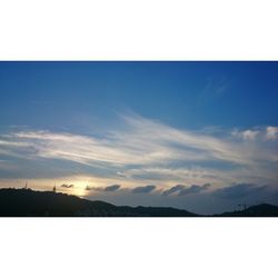 Scenic view of landscape against cloudy sky