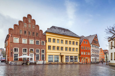 View of buildings against cloudy sky