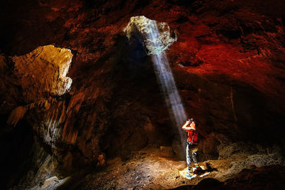 Man standing in cave