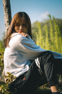 Woman sitting on field