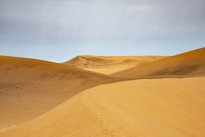 Scenic view of desert against sky