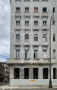 Low angle view of an under repair building against sky