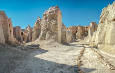 Panoramic view of desert against clear sky