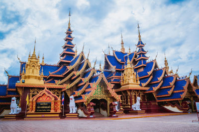 Temple outside building against sky