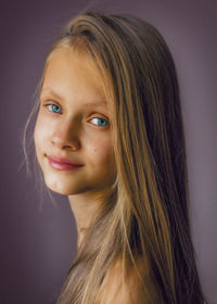 Close-up portrait of a smiling young woman