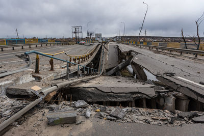 Bridge over the river irpin. the bridge was blown up to prevent russian troops from passing through.