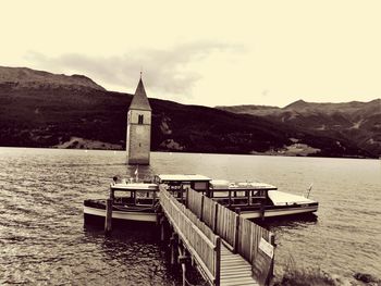 Calm lake with mountains in background