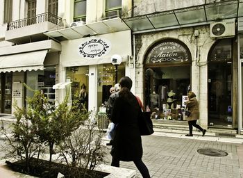 Woman standing in front of building