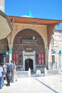 Rear view of people outside temple