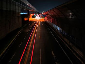 Light trails on railroad tracks at night