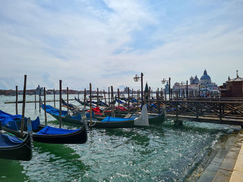 Boats moored at harbor