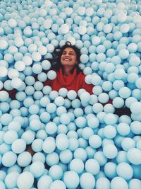 Smiling woman in ball pool