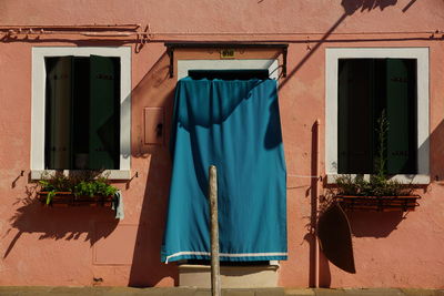 Textile hanging on door of house