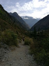 Pathway on mountain against sky