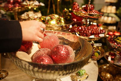 Midsection of person holding fruits