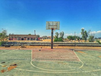 View of basketball hoop against blue sky
