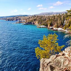 Scenic view of sea against blue sky