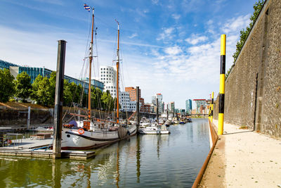Boats moored at harbor