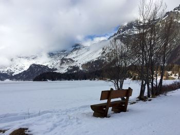 Scenic view of snow covered field against sky