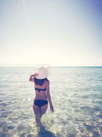 Silhouette of people in sea