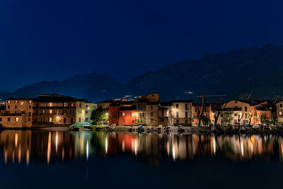 Reflection of illuminated buildings in water