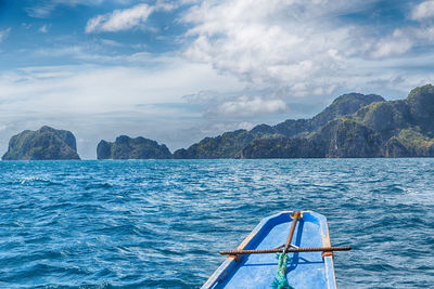 Sailboat sailing in sea against sky