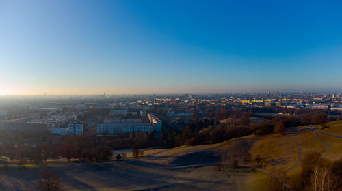 High angle view of city at sunset