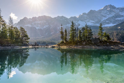 Scenic view of lake and mountains against sky