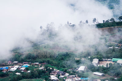 High angle view of buildings in city against sky