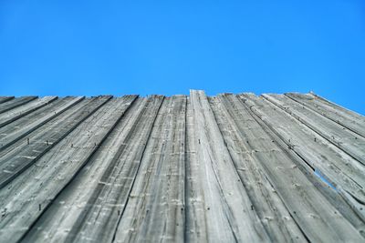 Wooden structure against clear blue sky