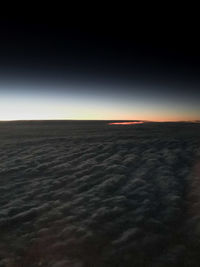 Scenic view of landscape against sky at sunset