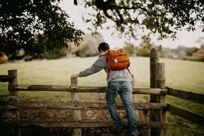 Rear view of man standing on field