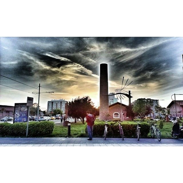 building exterior, architecture, built structure, sky, transfer print, cloud - sky, auto post production filter, city, cloud, tree, cloudy, grass, men, lifestyles, person, building, plant, day