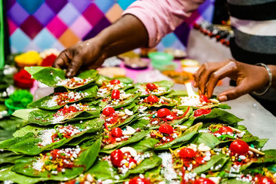 Close-up of hand preparing food