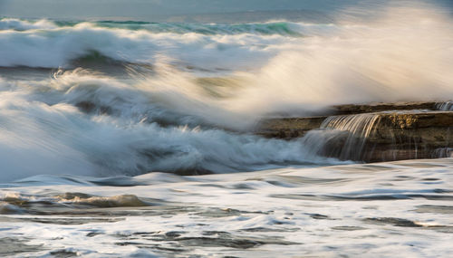 Sea waves splashing on shore