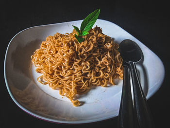High angle view of noodles in plate on table