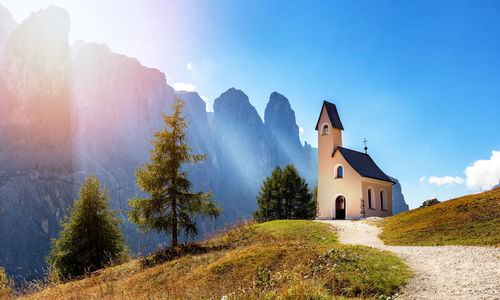 Panoramic view of trees and buildings against sky