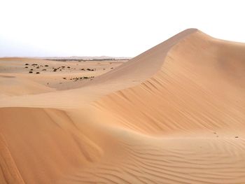 Scenic view of desert against clear sky