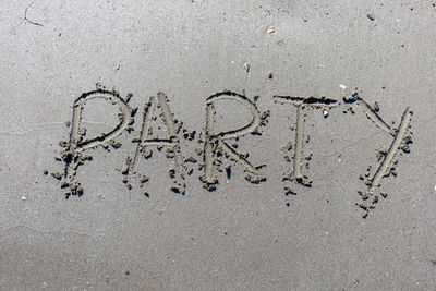 High angle view of footprints on sand