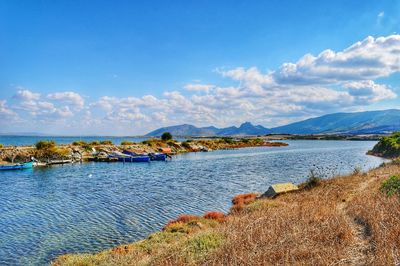 Scenic view of sea against cloudy sky