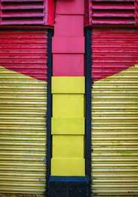 Colorful shutters over a business at the end of the day.