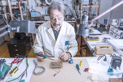 Electronic engineer in the laboratory with a soldering iron