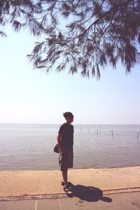 Full length of man on beach against sky