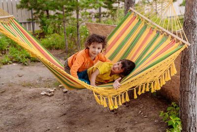 Children playing in the hammock